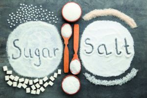 Inscription Sugar and Salt on grey wooden table