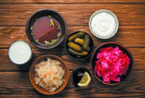 Fermented foods like yogurt, the yogurt drink kefir, miso, fermented kambucha tea, and pickled vegetables are good for nourishing a healthy gut microbiome.