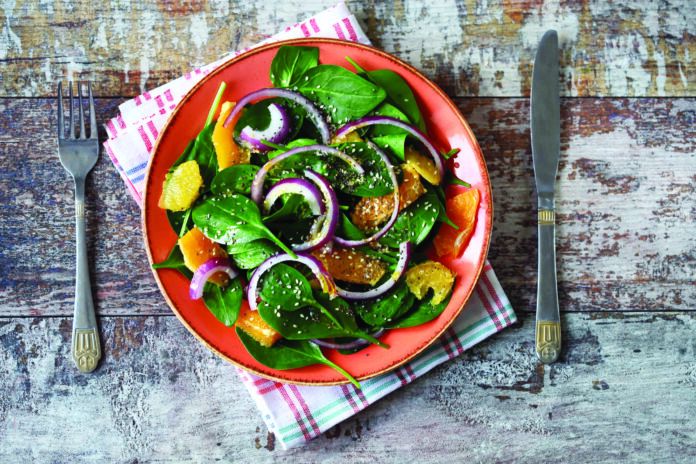 Healthy salad with spinach and orange.